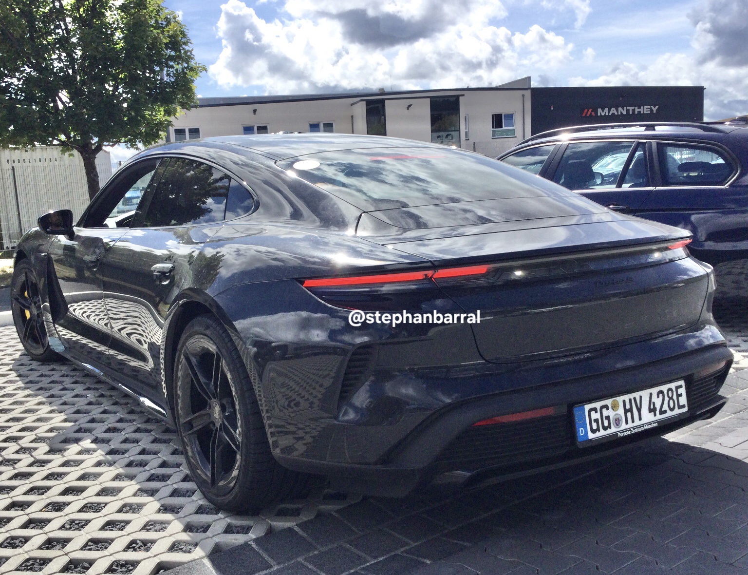 new porsche taycan spied with hyundai plates at hyundai building at the nurburgring